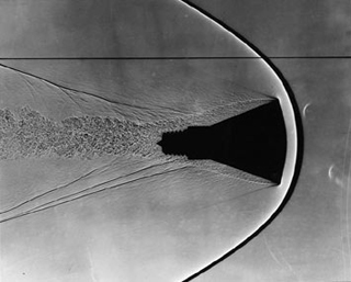 Mercury space capsule model with visible shockwaves and wake. Mercury space capsule model with visible shockwaves and wake.