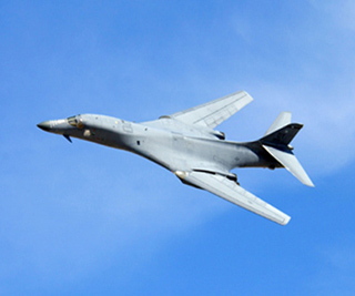 A B-1 Lancer bomber performs a fly-by. A B-1 Lancer bomber performs a fly-by.