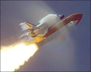 The shuttle passes Mach 1, producing shockwaves. The shuttle passes Mach 1, producing shockwaves.