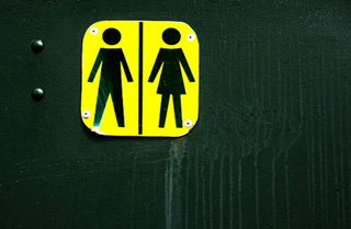 A sign for a unisex bathroom. A sign for a unisex bathroom.