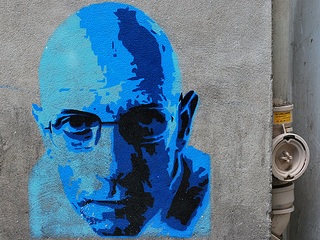 A photograph of a street art portrait of Michel Foucault. A photograph of a street art portrait of Michel Foucault.