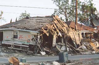 Photograph of a destroyed house. Photograph of a destroyed house.