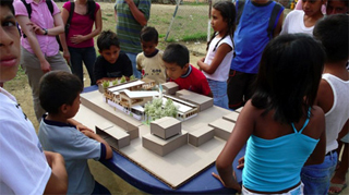 The children of Pascuales view their project. The children of Pascuales view their project.