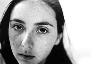 Black and white close-up photo of woman's face. Black and white close-up photo of woman's face.