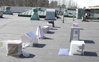 A photo of nine miniture house projects on a rooftop. A photo of nine miniture house projects on a rooftop.