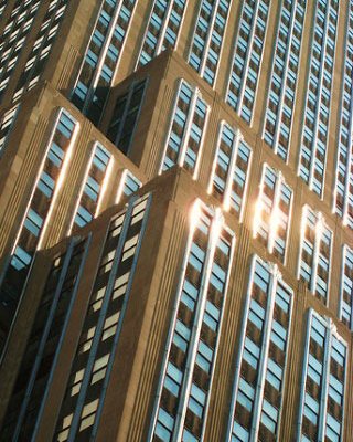 Photograph of sunlight reflecting off a high-rise building. Photograph of sunlight reflecting off a high-rise building.