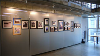 Student artwork on display in a gallery. Student artwork on display in a gallery.