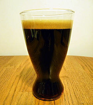 a photograph showing a glass of beer a photograph showing a glass of beer