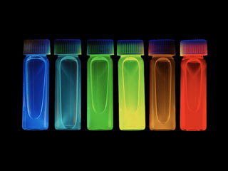 small, semi-transparent vials ranging in color from red to orange, yellow, green, and blue. small, semi-transparent vials ranging in color from red to orange, yellow, green, and blue.
