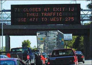 Photograph of heavy traffic on a highway. Photograph of heavy traffic on a highway.