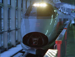 A photograph of the nose of a high speed train. A photograph of the nose of a high speed train.