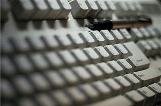 Photograph of pen on keyboard. Photograph of pen on keyboard.