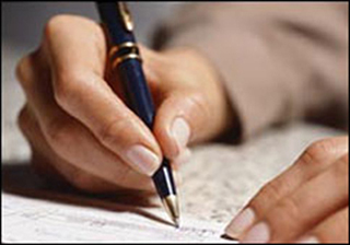 Photo of a hand holding a pen. Photo of a hand holding a pen.