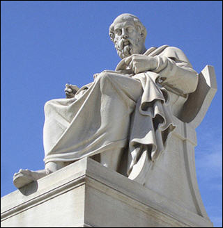 A white marble statue of Socrates in Athens, Greece in front of a clear blue sky. A white marble statue of Socrates in Athens, Greece in front of a clear blue sky.
