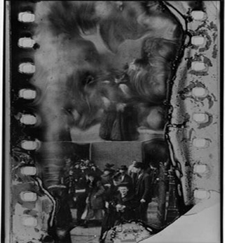 A piece of very deteriorated black and white film. A piece of very deteriorated black and white film.