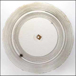 A photograph of a "glass disc," an early type of audio recording, made in the 1880s. A photograph of a "glass disc," an early type of audio recording, made in the 1880s.