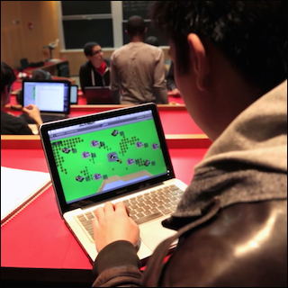 Image of a video game, featuring blue and black shapes on a green background. Image of a video game, featuring blue and black shapes on a green background.