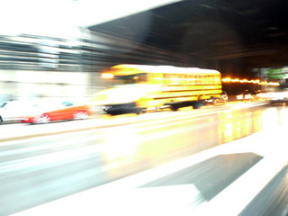 Photo of schoolbus on highway, blurred with speed. Photo of schoolbus on highway, blurred with speed.