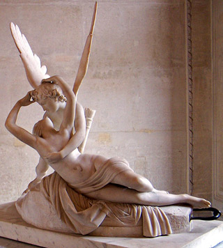 A marble statue of a winged gentleman embracing a reclining woman. A marble statue of a winged gentleman embracing a reclining woman.
