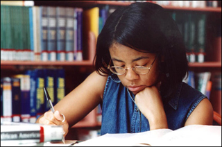 Young girl studying. Young girl studying.