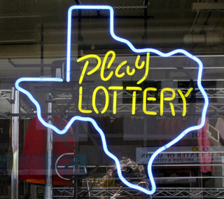 A photograph of a store window with an outline of the state of Texas in neon. Inside the outline are the words "Play Lottery." A photograph of a store window with an outline of the state of Texas in neon. Inside the outline are the words "Play Lottery."