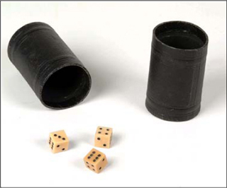 A photograph of three dice and two dice cups. A photograph of three dice and two dice cups.