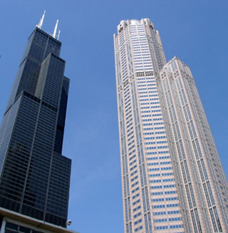 Photo of two skyscrapers against a blue sky. Photo of two skyscrapers against a blue sky.
