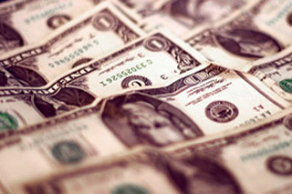 A sepia toned photograph of United States currency. A sepia toned photograph of United States currency.