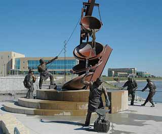 Bronze sculpture of laborers working. Bronze sculpture of laborers working.