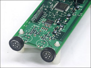 A mixed-signal printed circuit board containing both analog and digital components. A mixed-signal printed circuit board containing both analog and digital components.