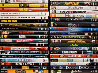 Photograph of two stacks of movies. Photograph of two stacks of movies.