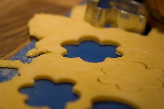 Photograph of a cookie cutter and cookie dough. Photograph of a cookie cutter and cookie dough.