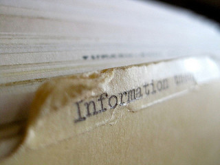 A series of manila folders in a filing cabinet. One is prominently labeled "Information Theory". A series of manila folders in a filing cabinet. One is prominently labeled "Information Theory".