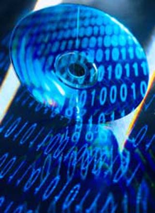 An image showing a multitude of ones and zeroes that comprise binary code, being reflected of the surface of an optical disc. An image showing a multitude of ones and zeroes that comprise binary code, being reflected of the surface of an optical disc.