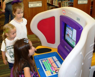 Image of children using a Tiny Tyke computer. Image of children using a Tiny Tyke computer.