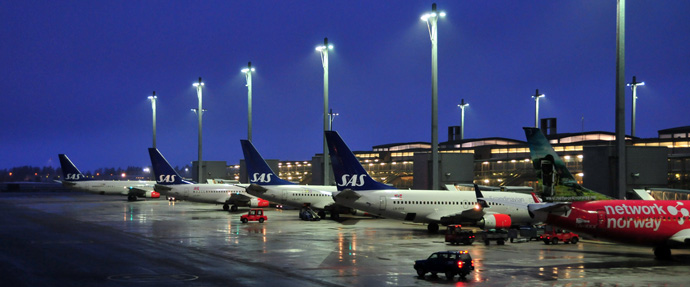 Planes near the runway at Gardermoen airport near Oslo, Norway Planes near the runway at Gardermoen airport near Oslo, Norway