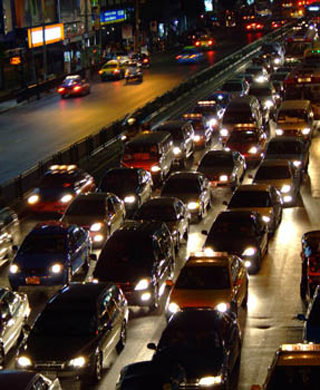 Photo of many cars at night stuck on a highway in Bangkok. Photo of many cars at night stuck on a highway in Bangkok.