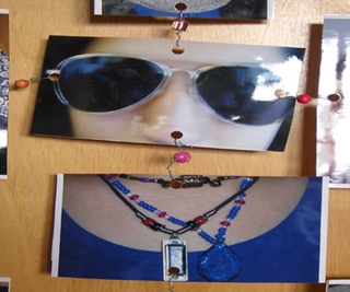Photo of a person's face, sunglasses, shirt and necklaces. Photo of a person's face, sunglasses, shirt and necklaces.