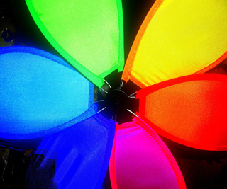 Photo of rainbow-colored fabric panels. Photo of rainbow-colored fabric panels.