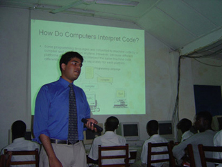 MIT student teaching African students. MIT student teaching African students.