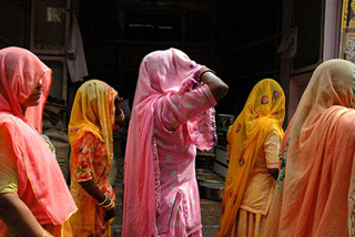 Women in brightly colored saris. Women in brightly colored saris.