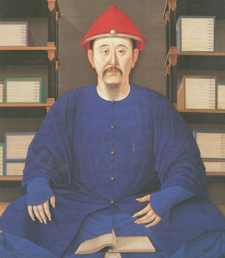 Gentleman wearing robes sits cross-legged on the floor reading a book. Gentleman wearing robes sits cross-legged on the floor reading a book.
