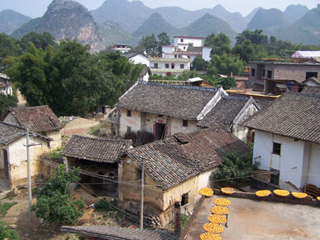 Rooftop view of Chinese farmhouses, moutains in the background. Rooftop view of Chinese farmhouses, moutains in the background.