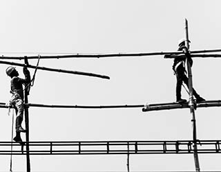 Workers on scaffolding. Workers on scaffolding.
