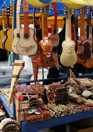 A photo of a stand selling handmade musical instruments. A photo of a stand selling handmade musical instruments.