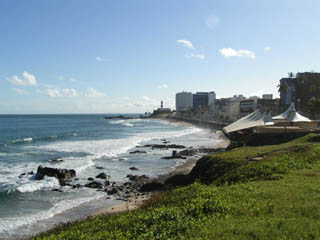 Photo of a beach with tall city buildings in the background. Photo of a beach with tall city buildings in the background.