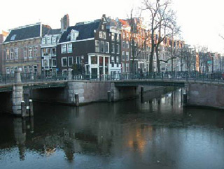 Traditional Dutch buildings with a canal in the foreground. Traditional Dutch buildings with a canal in the foreground.