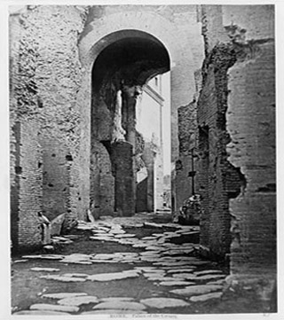 A photograph of an archway in the Palace of the Caesars. A photograph of an archway in the Palace of the Caesars.