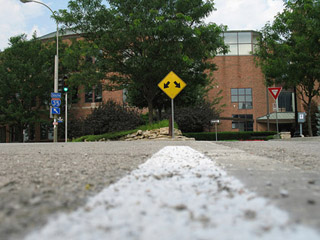 A road sign indicating a diverging roadway. A road sign indicating a diverging roadway.