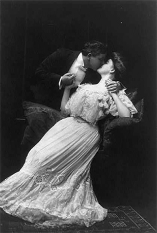 A photo of a couple kissing. A photo of a couple kissing.